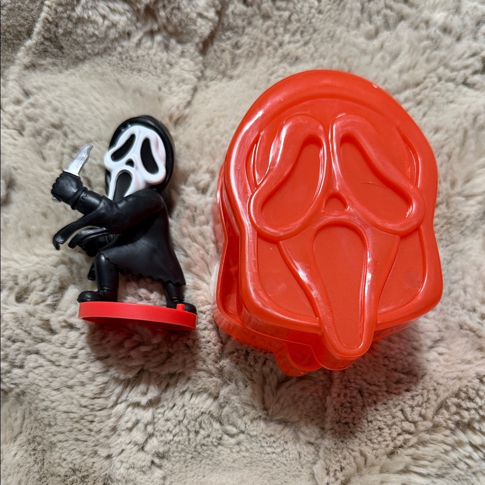 Spooky Masked Figure with Red Case